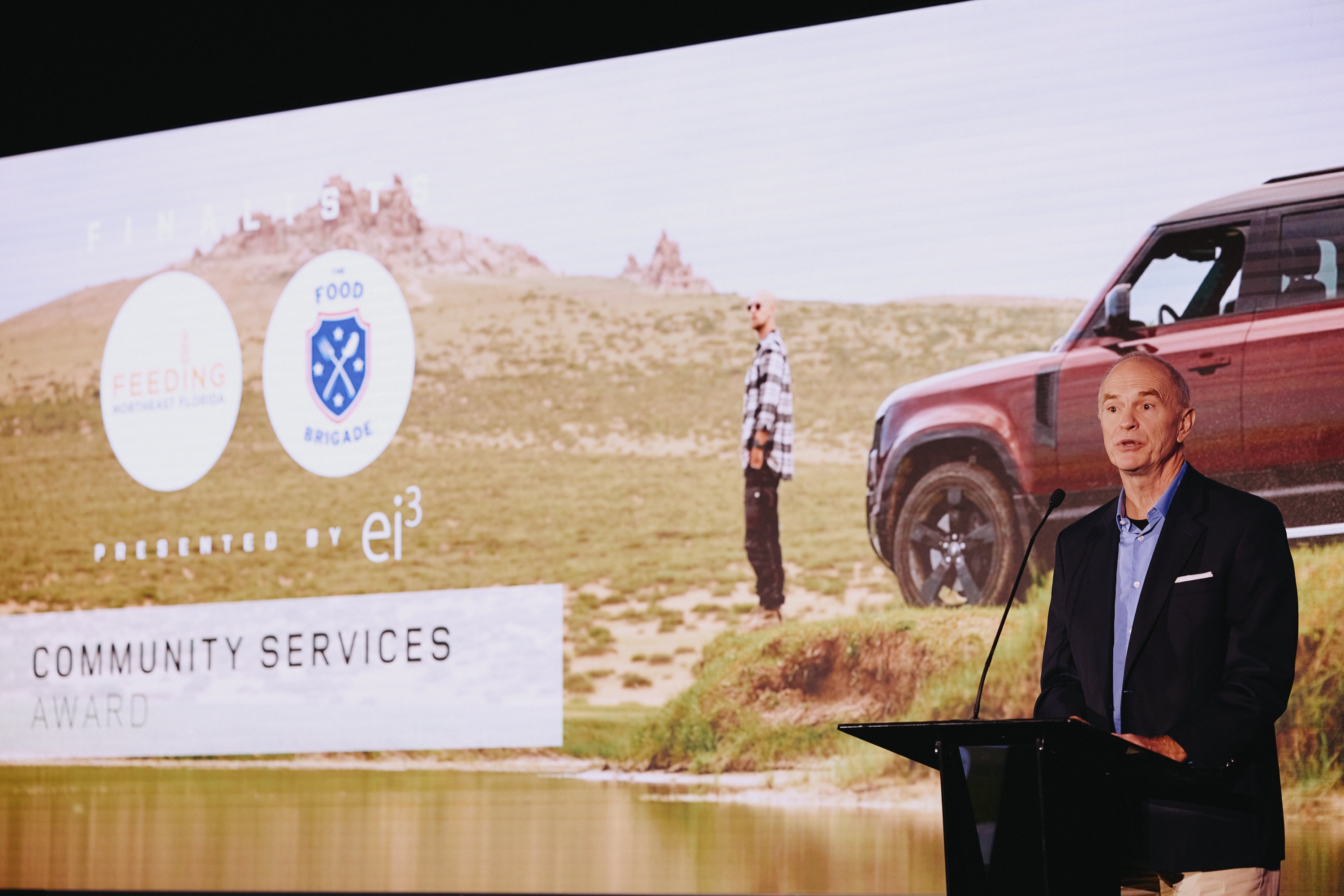 Spencer Cramer presenting the Community Service Category Award at Destination Defender